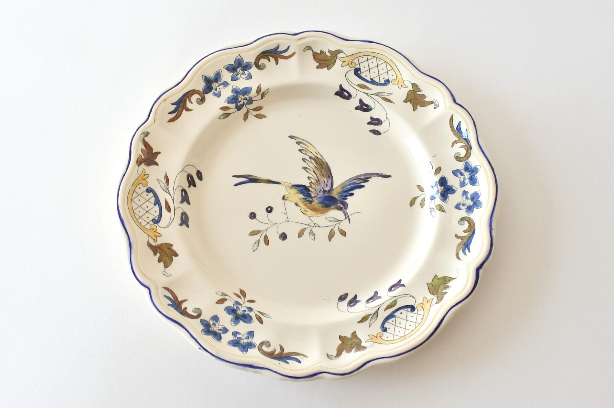 Piatto in ceramica di Longchamp con uccellino e ramo di fiori