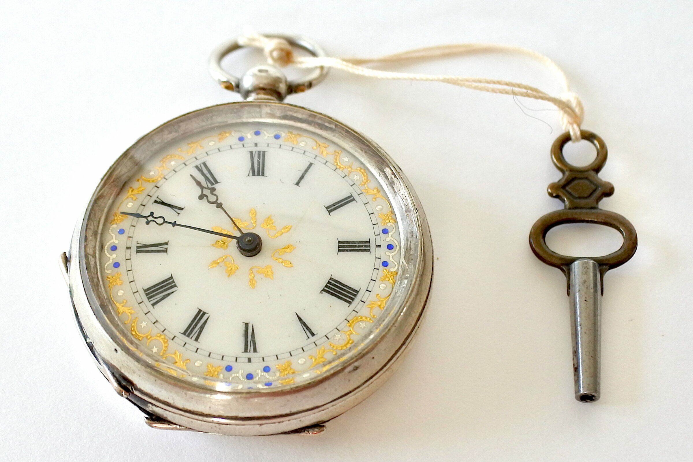 Orologio da tasca in argento e quadrante avorio con decori dorati